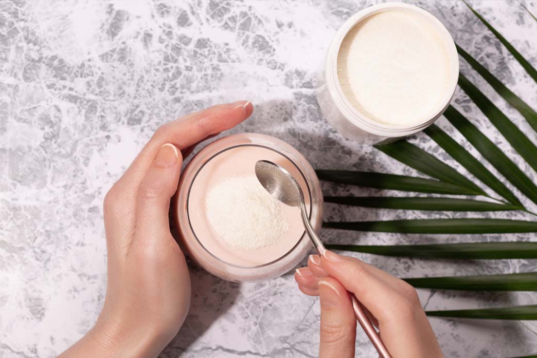 Supplement powder being scooped and used to achieve glass skin