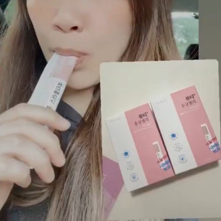 Skincare enthusiast, Christine Lee, username Christine underscore LLH, sucking on a sachet of ginseng beauty jelly