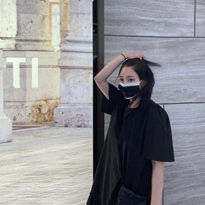 Korean model showing off the disposable mask with a casual look